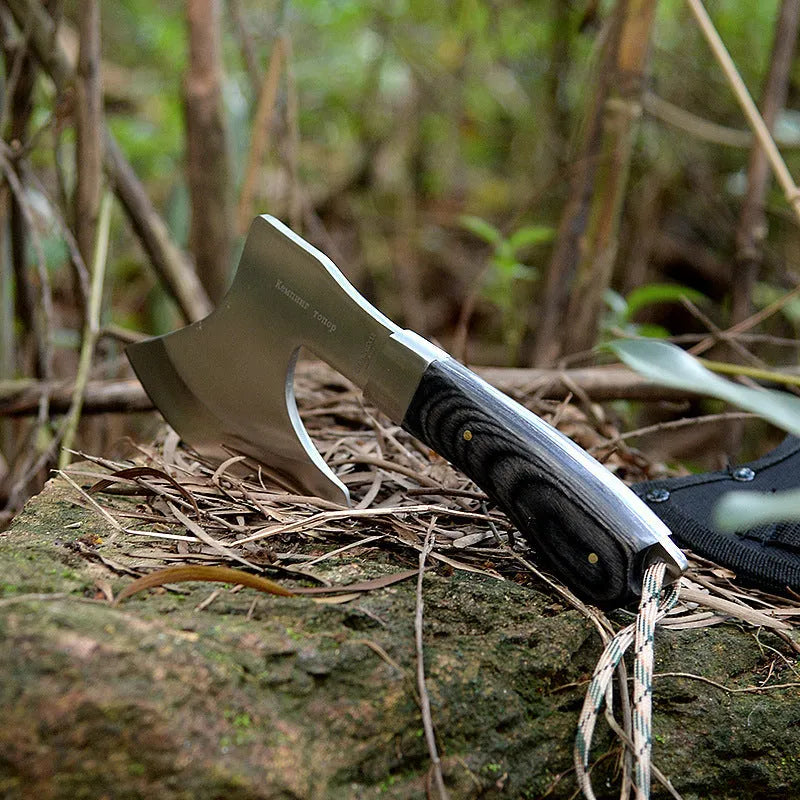 Outdoor Tactics stainless steel axe on ground, 57cm length, 49HRC hardness for wood chopping