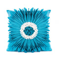 White polyester velvet cushion cover with blue chrysanthemum tufting pattern and fringed hem on a sofa