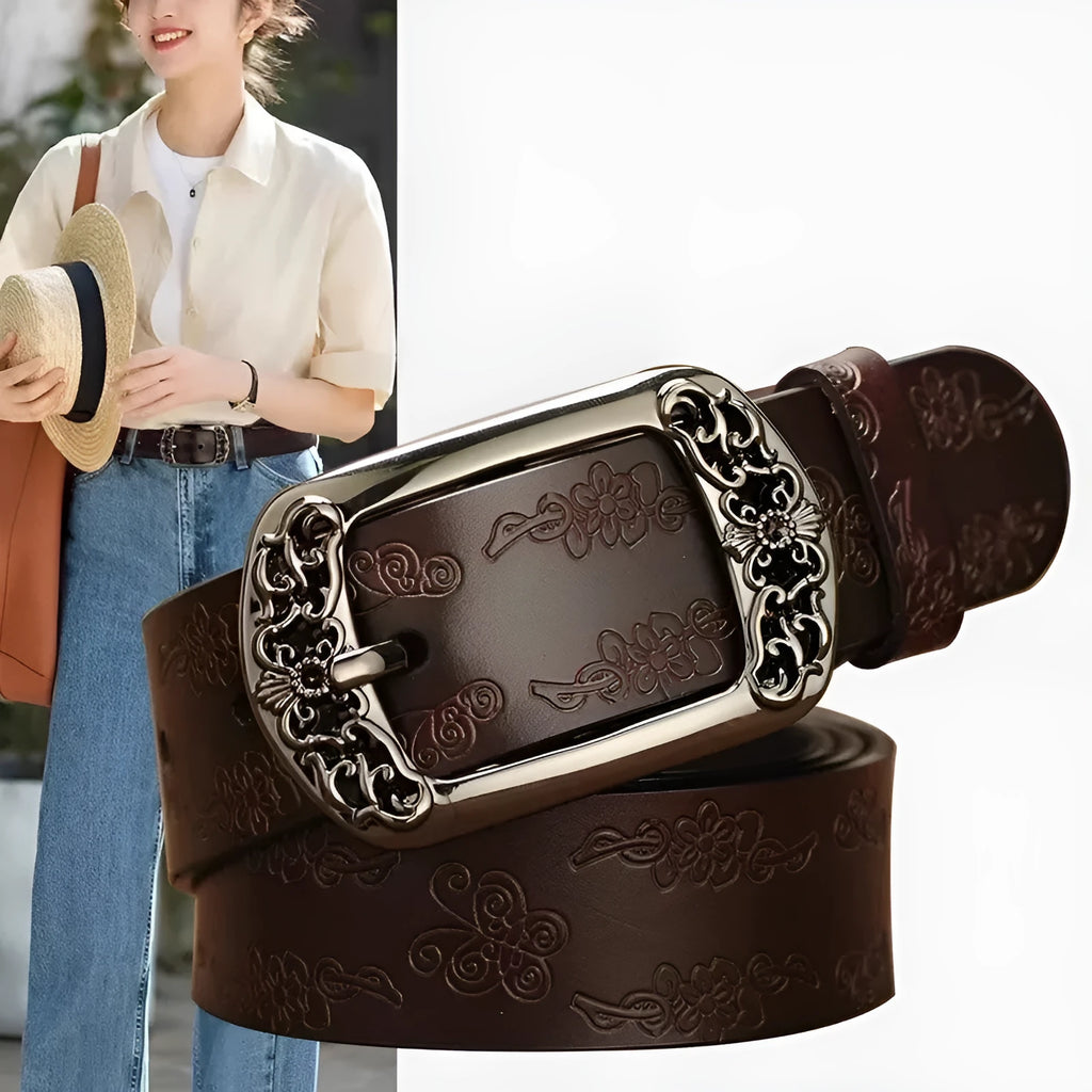 Thin black decorative jeans belt for women with an alloy buckle on a jeans waistband.