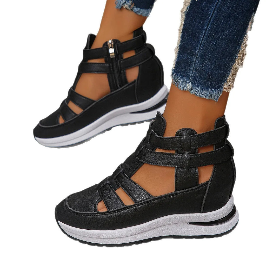 Black women's platform sandals with closed toe, hollow-out design and Velcro strap.