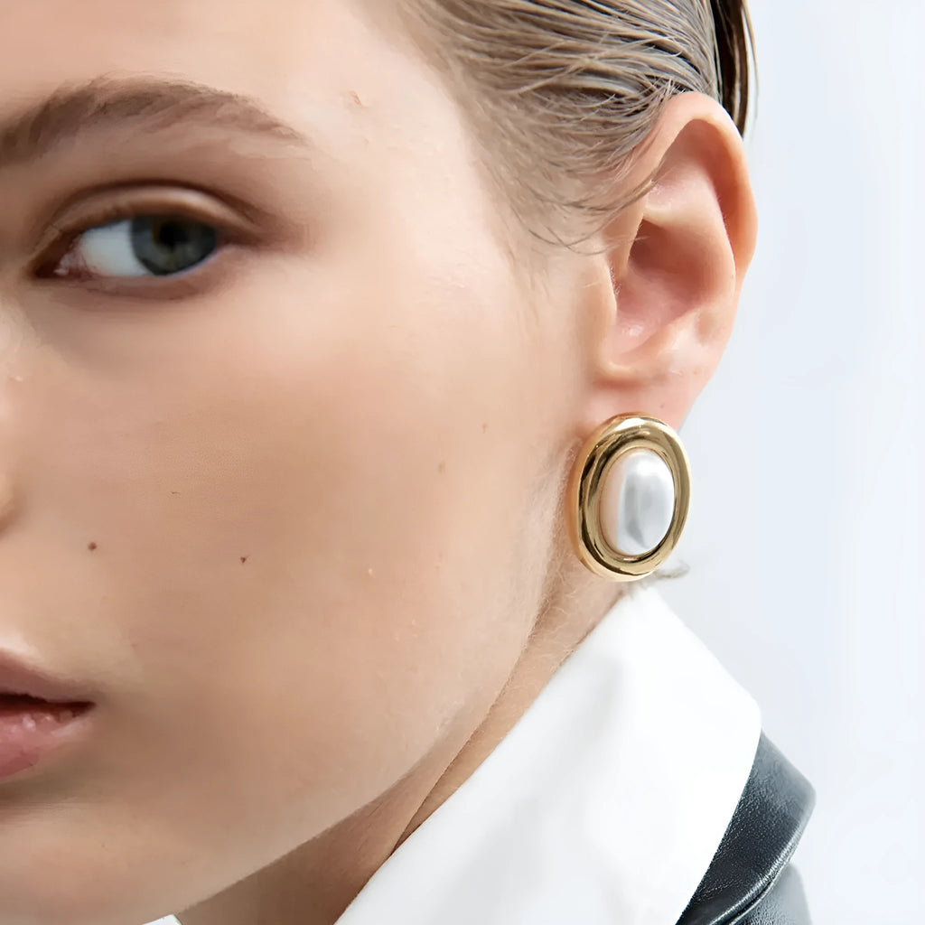 Close-up of women's stainless steel vintage pearl stud earrings with a 10mm white pearl.