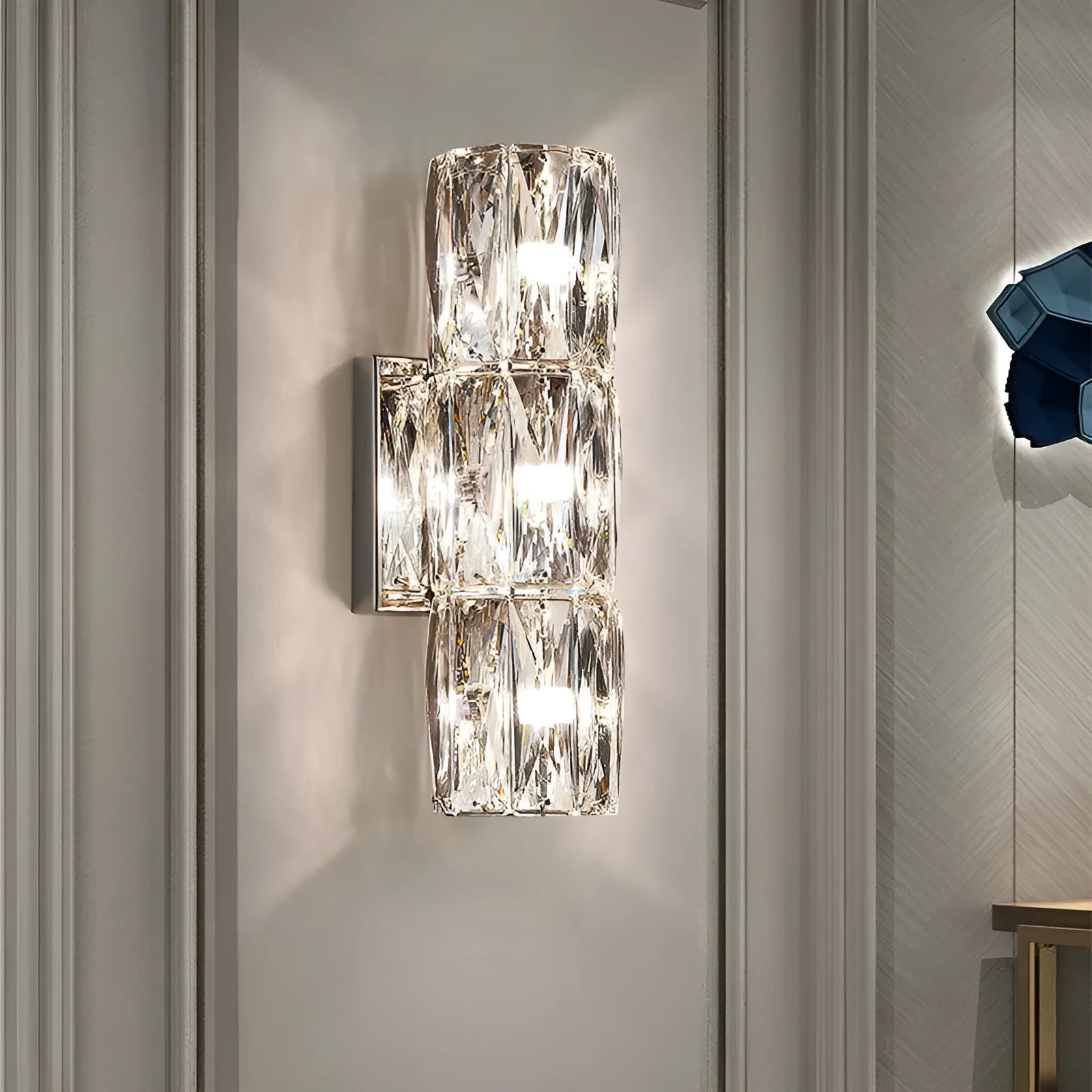 Crystal wall lamp with stainless steel body and LED lighting in chrome or gold finish