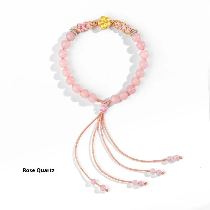 Hand-woven red rope bracelet with diamond shaped crystal and peach blossom Chinese design
