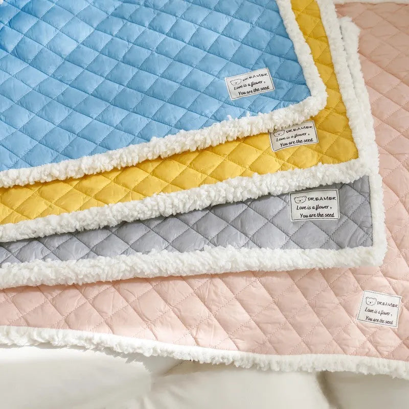 Soft blue terry cloth pet blanket for cats, shown on a pet bed, with size and colour options displayed.