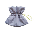 Soft light blue adjustable polyester cat recovery collar with elastic buckle on a flat surface.