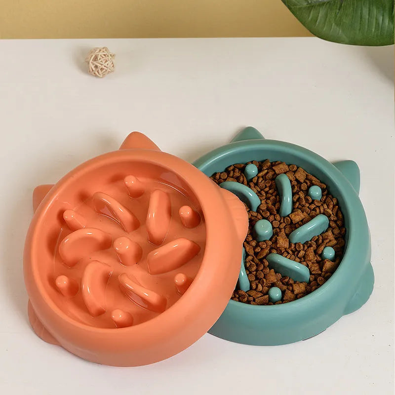 Green bone-shaped slow feeder dog bowl with internal ridges for anti-gulping.