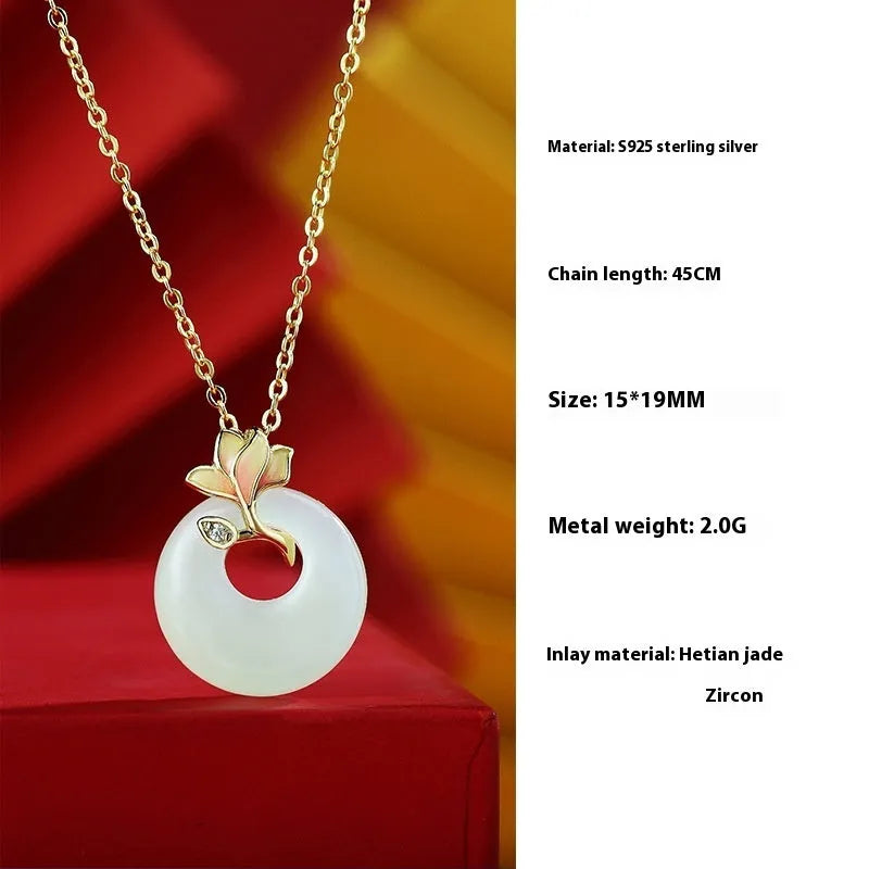 S925 sterling silver magnolia necklace, bracelet, and ear studs set with inlaid Hetian jade in a New Chinese floral style.