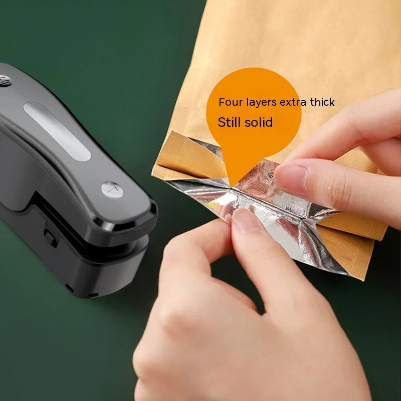 Rechargeable mini USB sealing machine in milky white with Type-C charging port and magnetic patch
