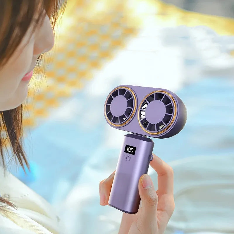 USB handheld mini fan with digital display screen in folded position showing milky white colour option