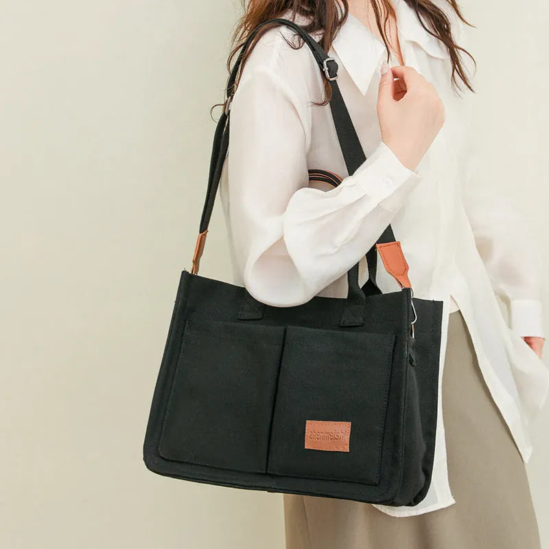Large capacity canvas tote bag for women with multiple pockets and crossbody strap in creamy white