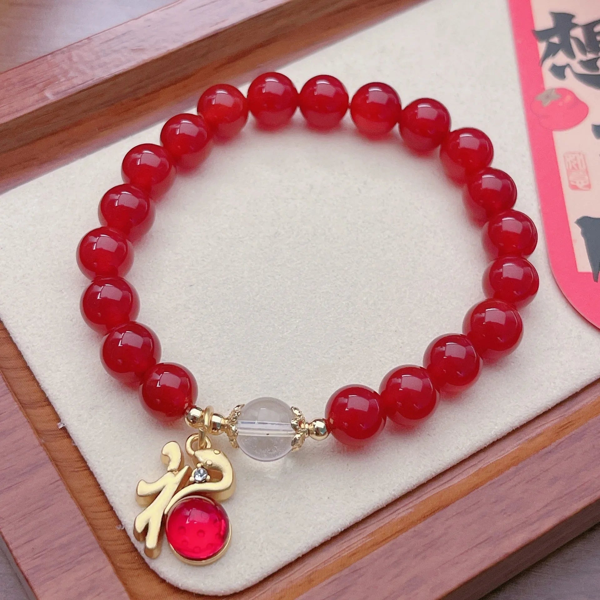 Handmade red agate bracelet with dragon design for women, Chinese style.
