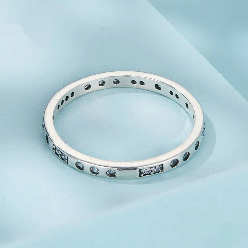 Silver I Love You Moss password ring with oxidized black finish showing engraved code