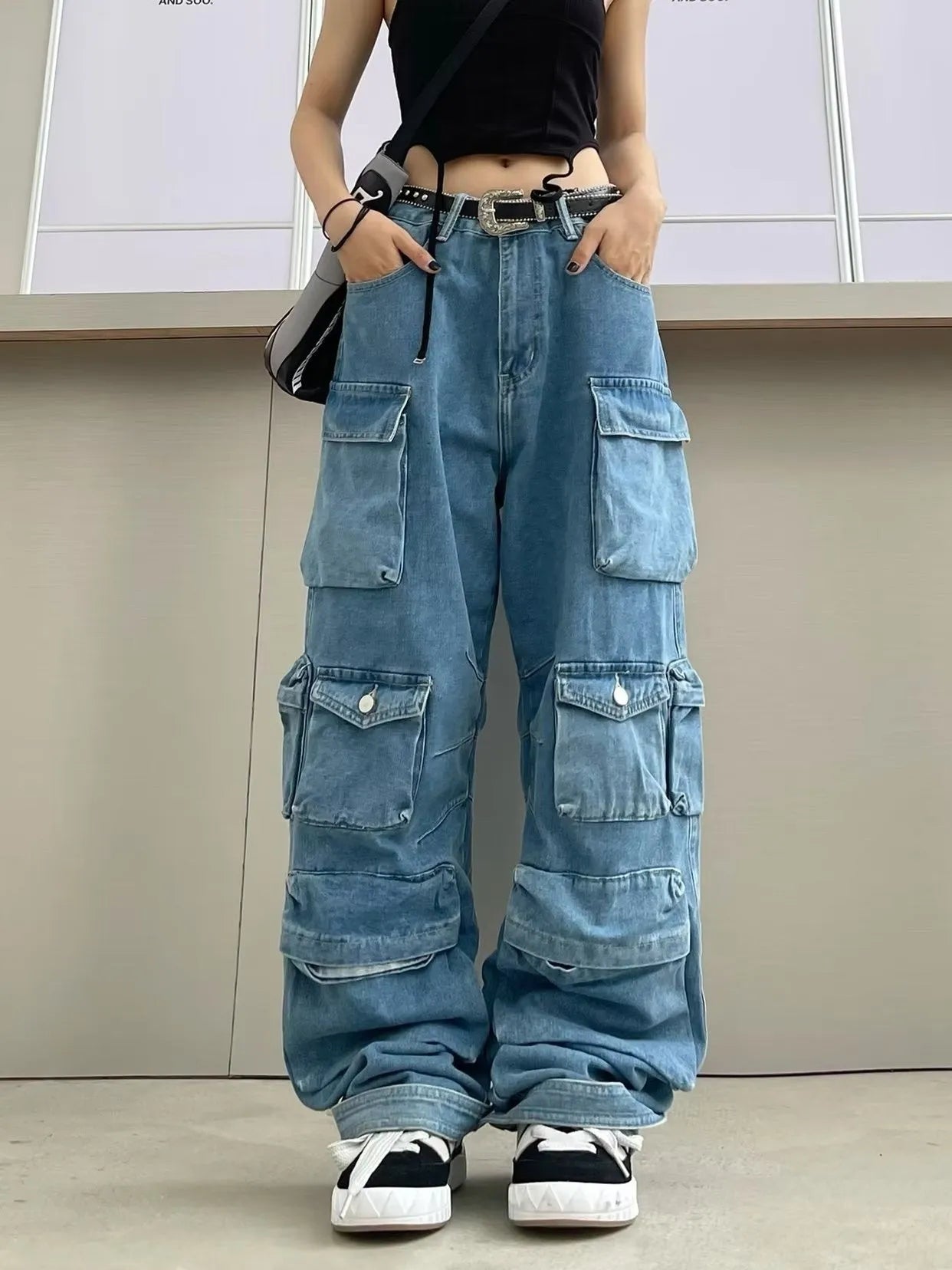 Women's high waist tie-dyed denim trousers with wide leg silhouette and multiple pockets in street hipster style