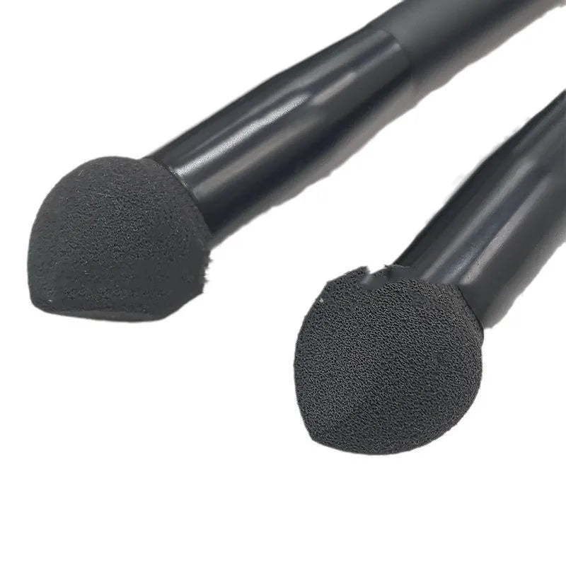 Black wooden-handled concealer brush with a sponge stick applicator tip.