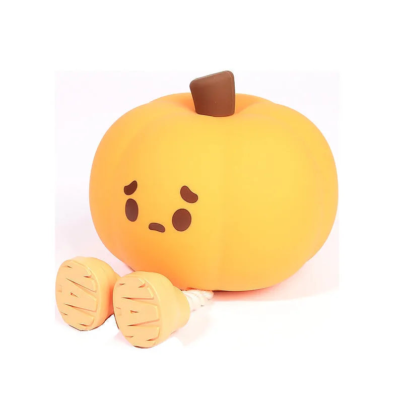 Soft silicone pumpkin-shaped night light with orange colour and touch dimming controls