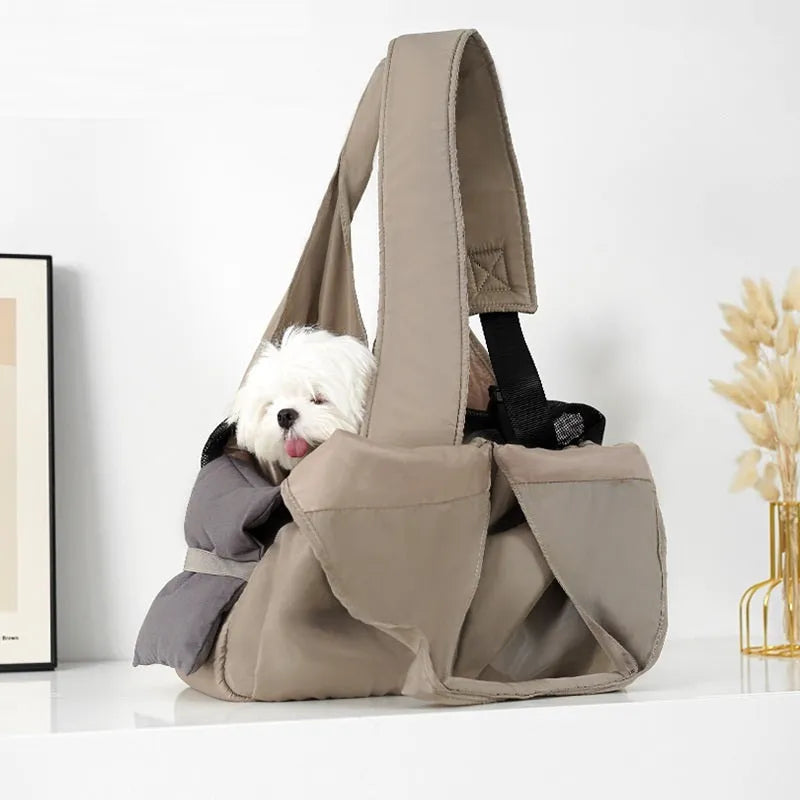 Apricot coloured cloth pet handbag carrier for cats or small dogs.