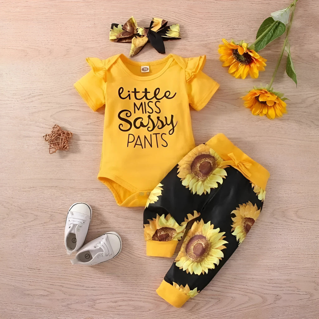 Baby jumpsuit set with cotton top, pants, and matching headband in black letter print