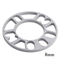 Set of four automotive wheel hub spacer gaskets showing different thicknesses of 3mm, 5mm, 8mm, and 10mm.