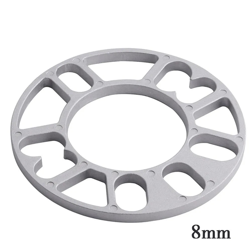 Set of four automotive wheel hub spacer gaskets showing different thicknesses of 3mm, 5mm, 8mm, and 10mm.