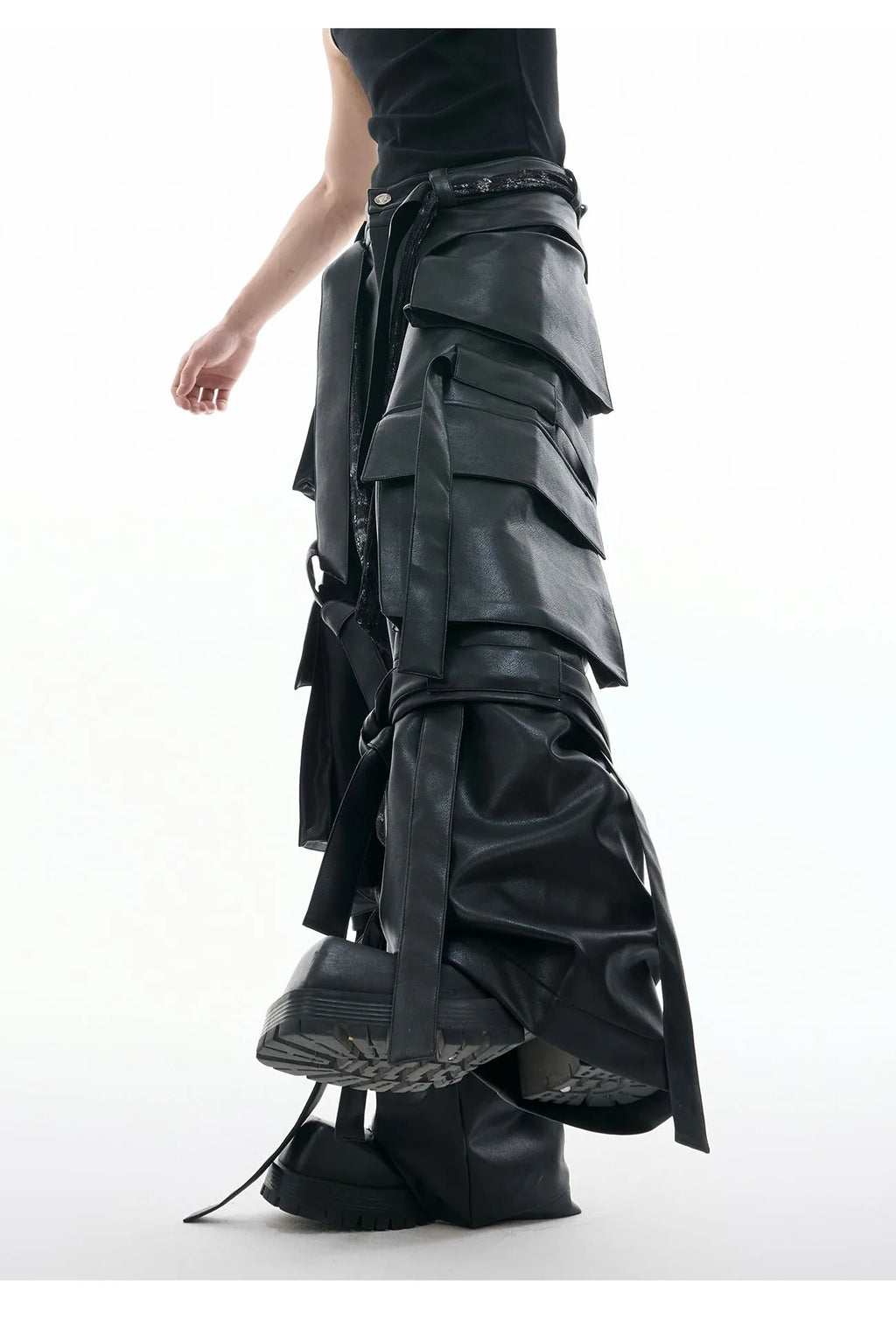 Black retro loose-fit trousers with multiple pockets and quilted leather-look fabric.