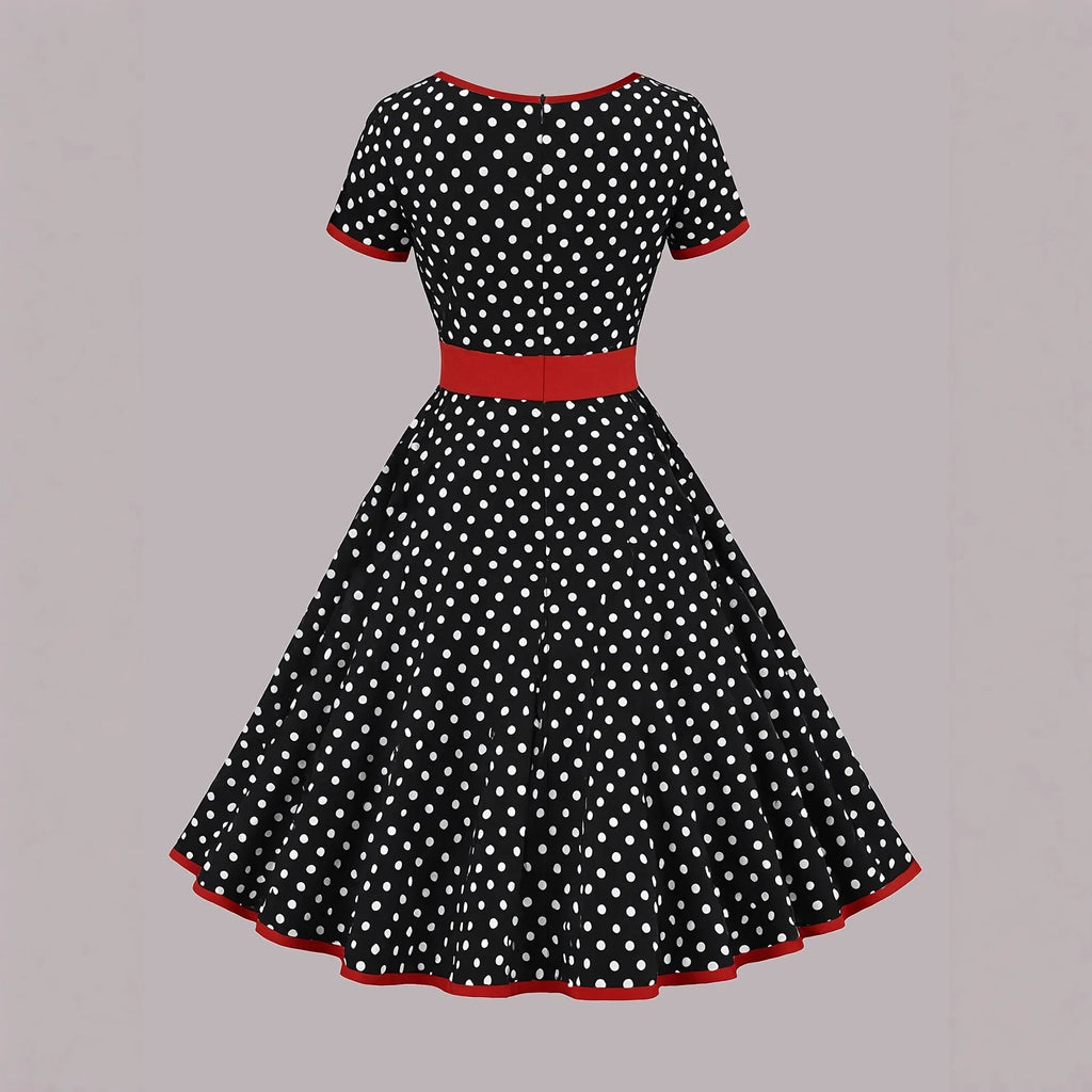 Multicolour polka dot pleated midi dress with a square collar and short sleeves on a hanger.