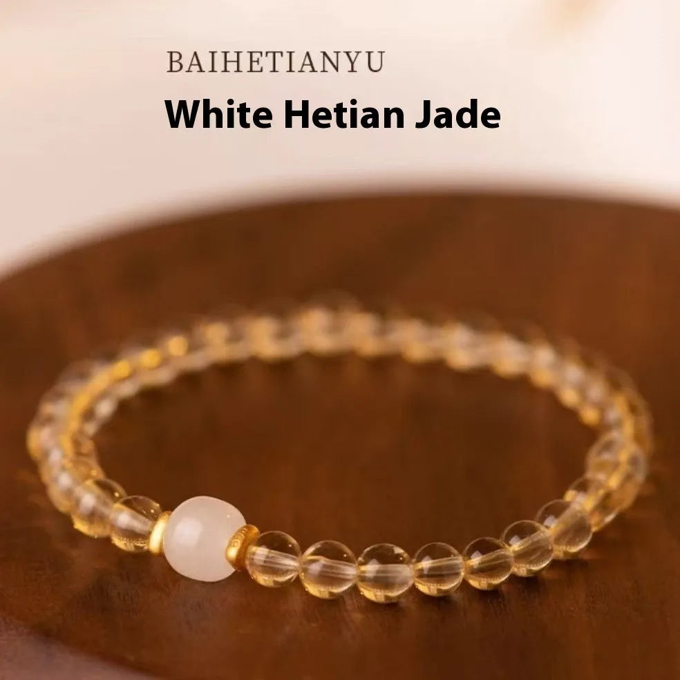 Handmade natural gold rutilated quartz bracelet from Brazil with Putuo stone and pearl accents