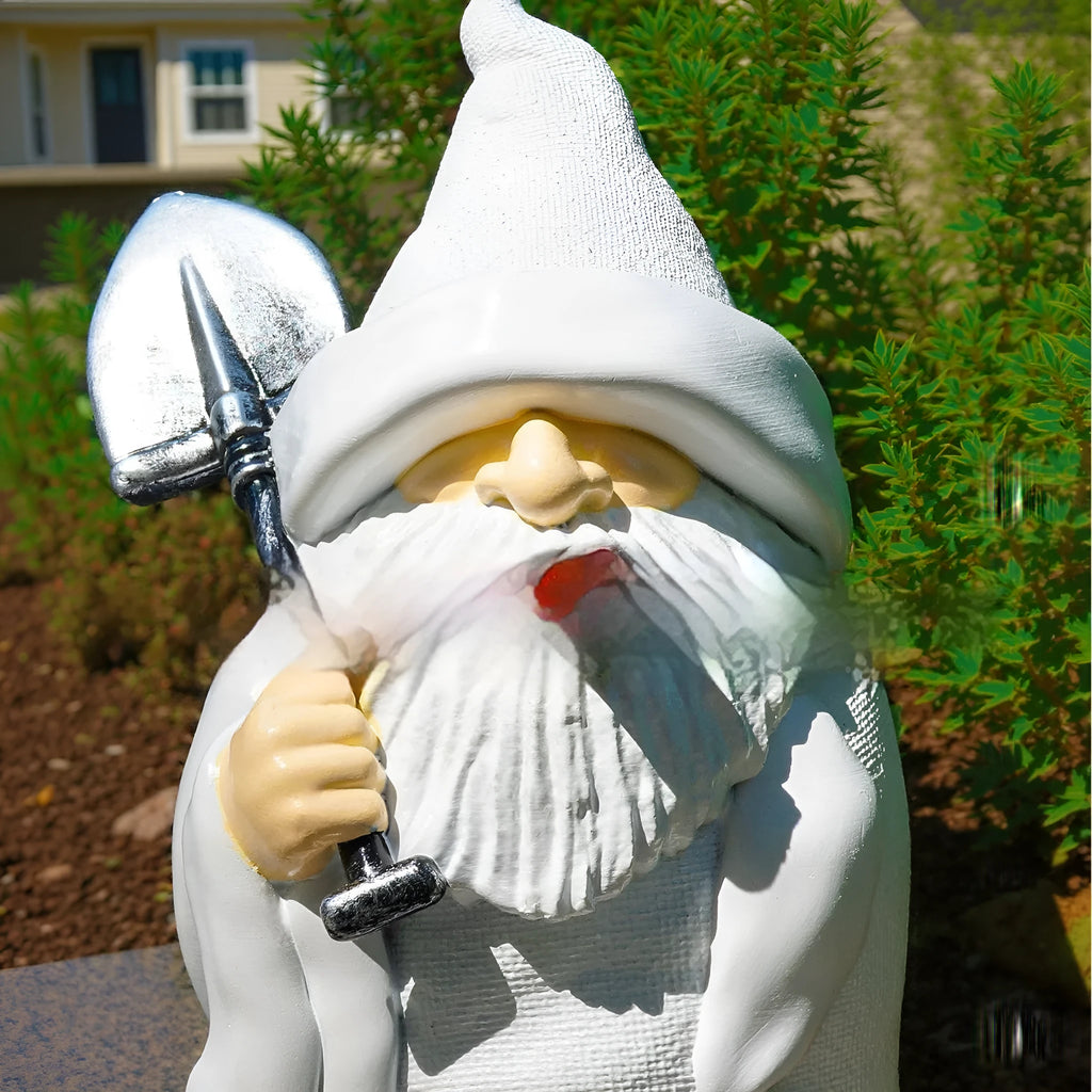 Christmas garden ornament showing dwarf character holding smoking shovel, resin craft figurine