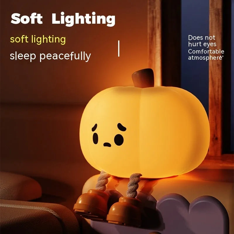 Soft silicone pumpkin-shaped night light with orange colour and touch dimming controls
