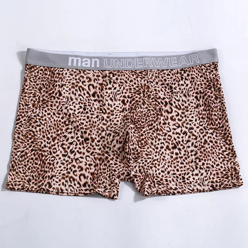 Men's loose fit leopard print boxer shorts in polyester milk silk fabric showing mid-waist design