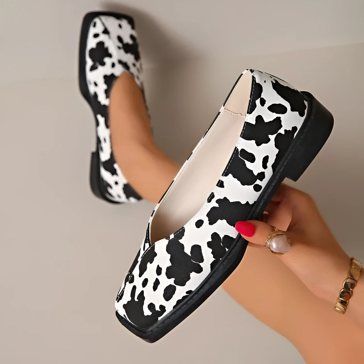 Women's black and white cow pattern flat shoes in first layer cowhide with 6-8cm high heel and rubber sole