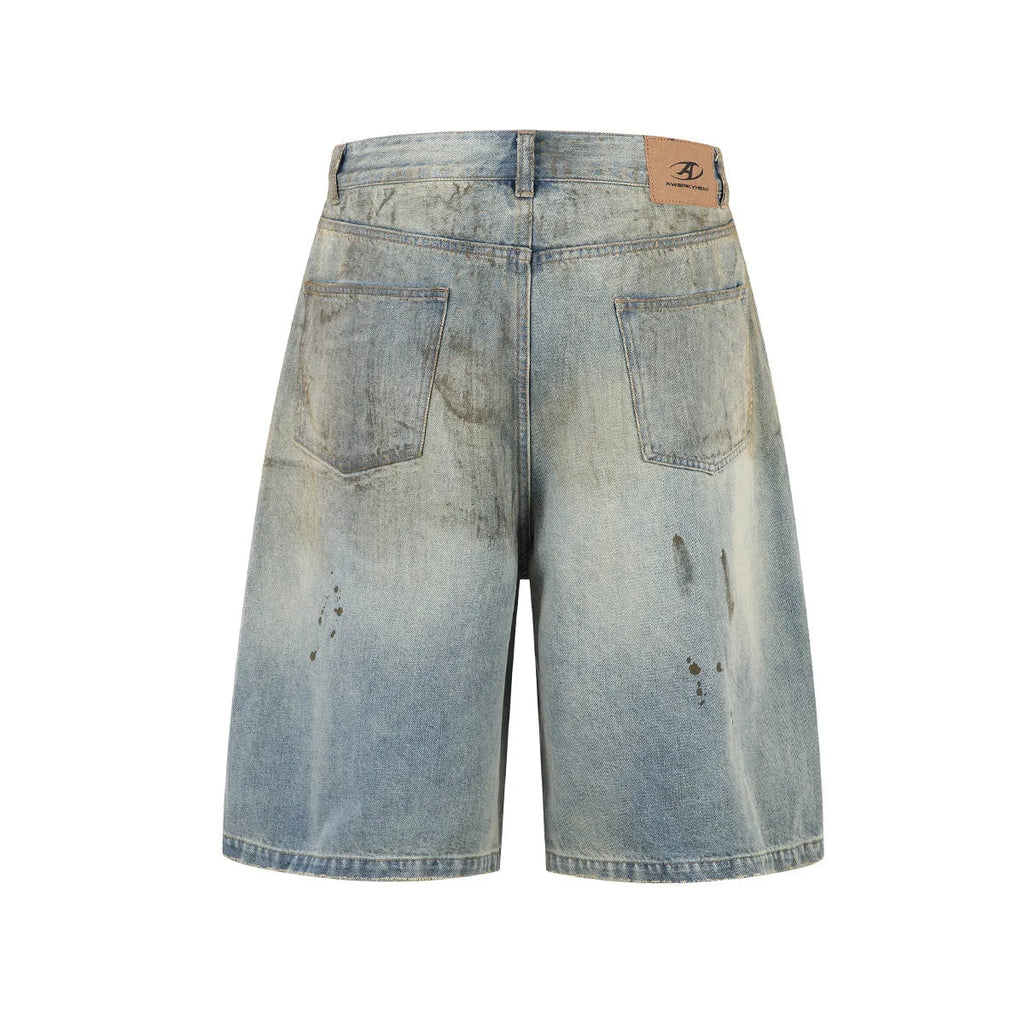 Blue washed straight leg denim trousers showing mid-length cut and zipper fly detail
