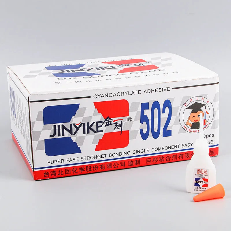 Tube of instant strong adhesive glue for shoe and leather repair with applicator tip.