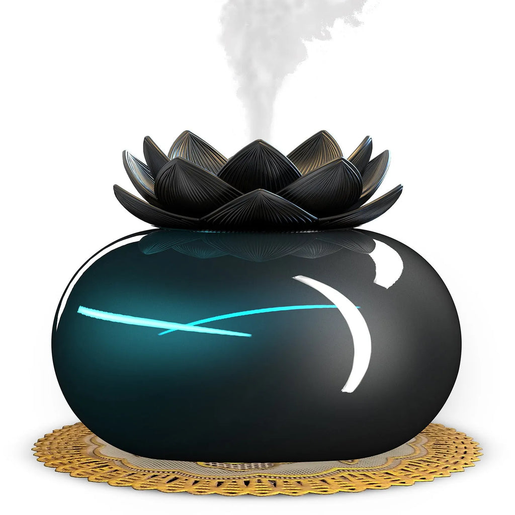 Pure black lotus-shaped aromatherapy humidifier with USB cable on a desk