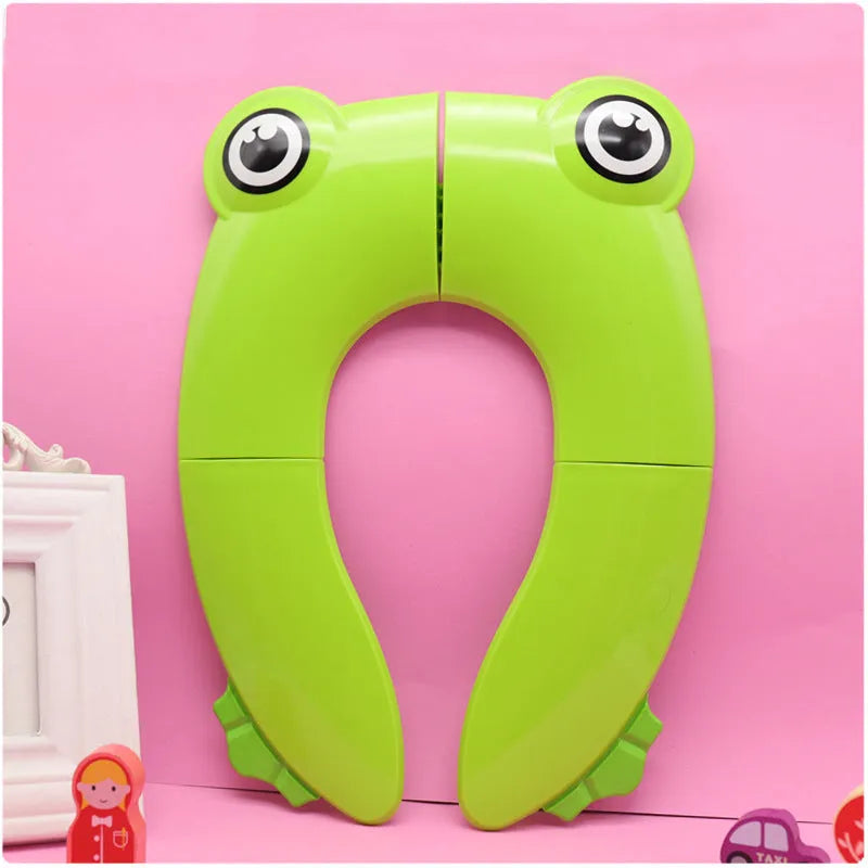 Children's toilet seat pad in PP, shown in blue or green with drawstring bag for toilet training