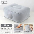 Grey inflatable seat cushion with a press valve, shown folded and inflated.