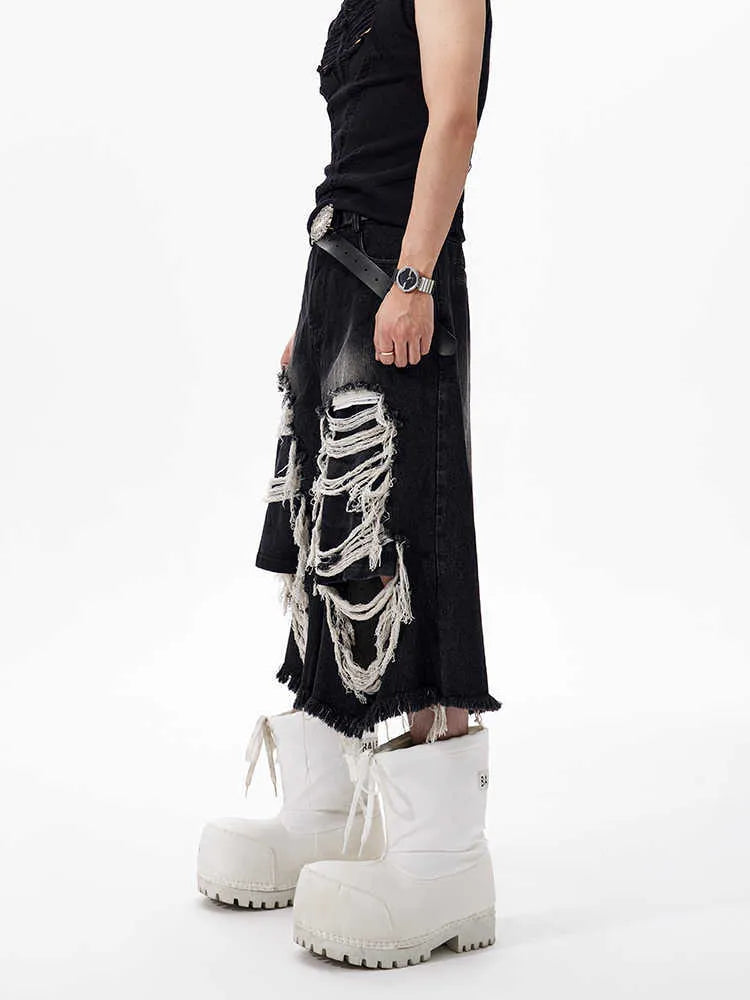 Black cropped wide-leg jeans with ripped patch details and mid-high waist