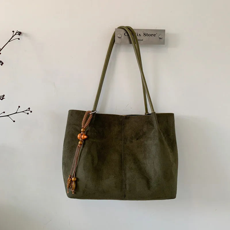 Large suede tote bag in brown with matching pendant, horizontal square shape, single shoulder strap, and retro styling