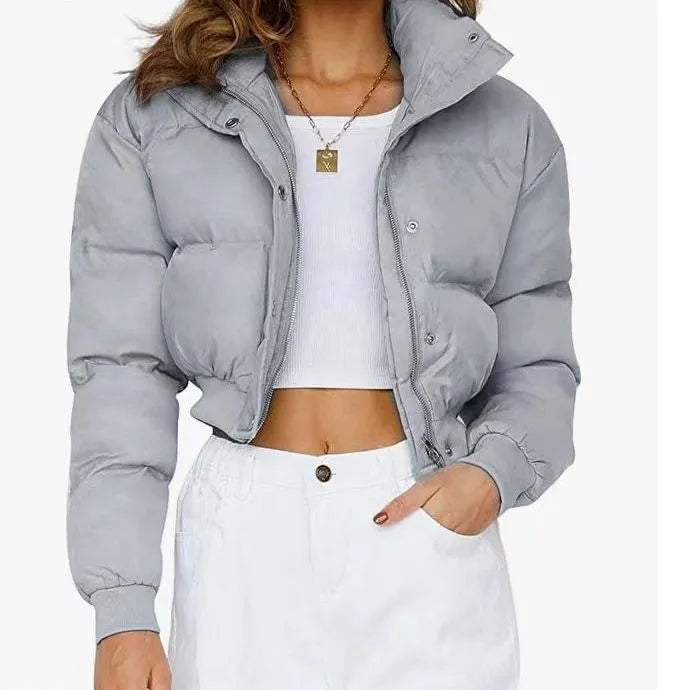 A woman's loose-fitting long sleeve polyester jacket in a casual style, shown in a blue colour variant.