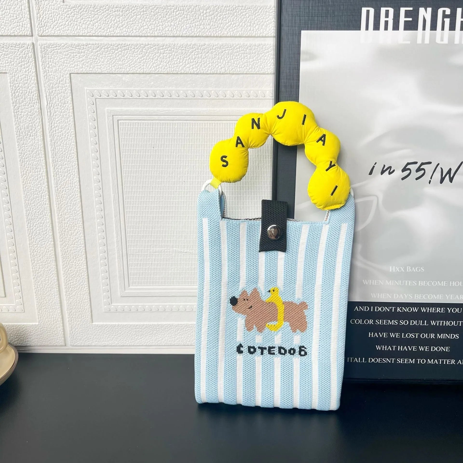 Cartoon knitted messenger bag with woven design and single shoulder strap