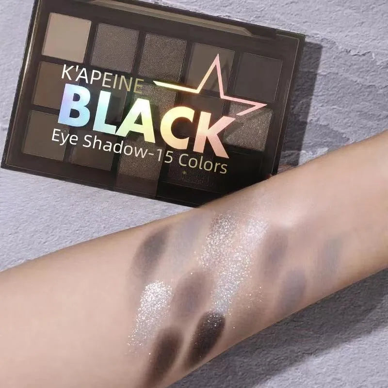 15-colour eye shadow palette showing matte shimmer shades including grey black and brown blue colours