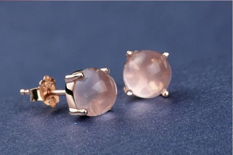 Women's rose gold drop shape stud earrings with synthetic ross quartz crystal inlay