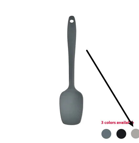 Silicone kitchen utensil set with twelve tools in a rotating white storage caddy on a counter.
