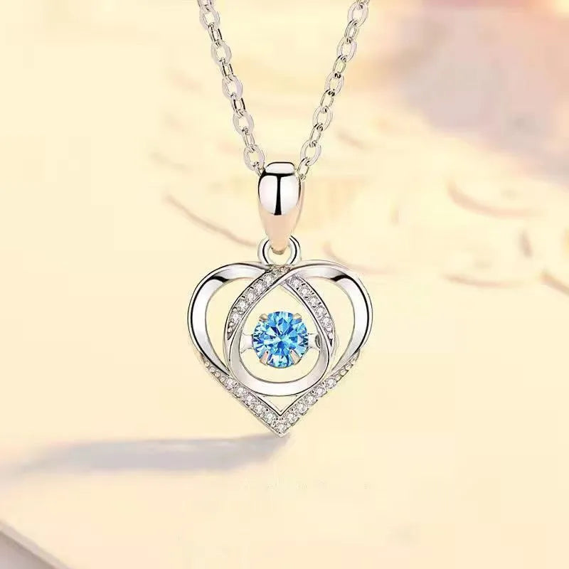 Blue diamond heart pendant necklace and matching bracelet jewellery set with mixed gem inlays