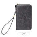 Brown PU leather travel document wallet with credit card slots and letter design, shown with a passport.