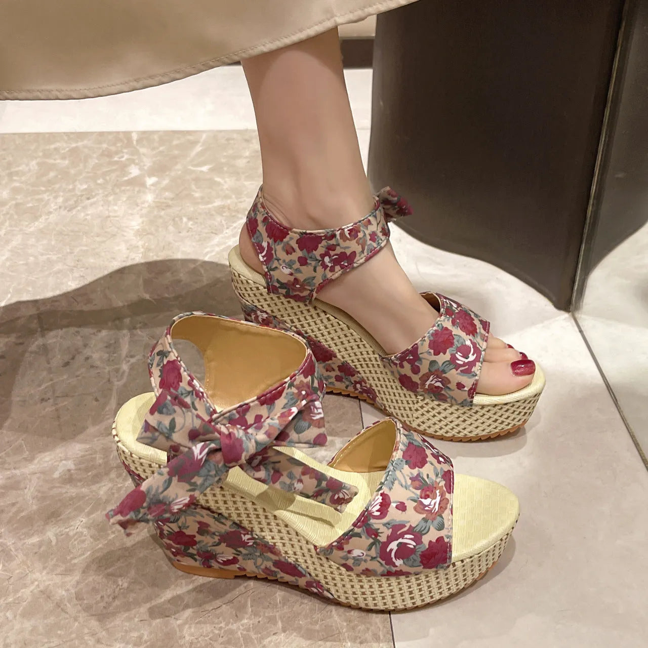 Women's floral wedge sandals with fish mouth peep toe and ankle strap buckle in pink, black, and blue patterns.