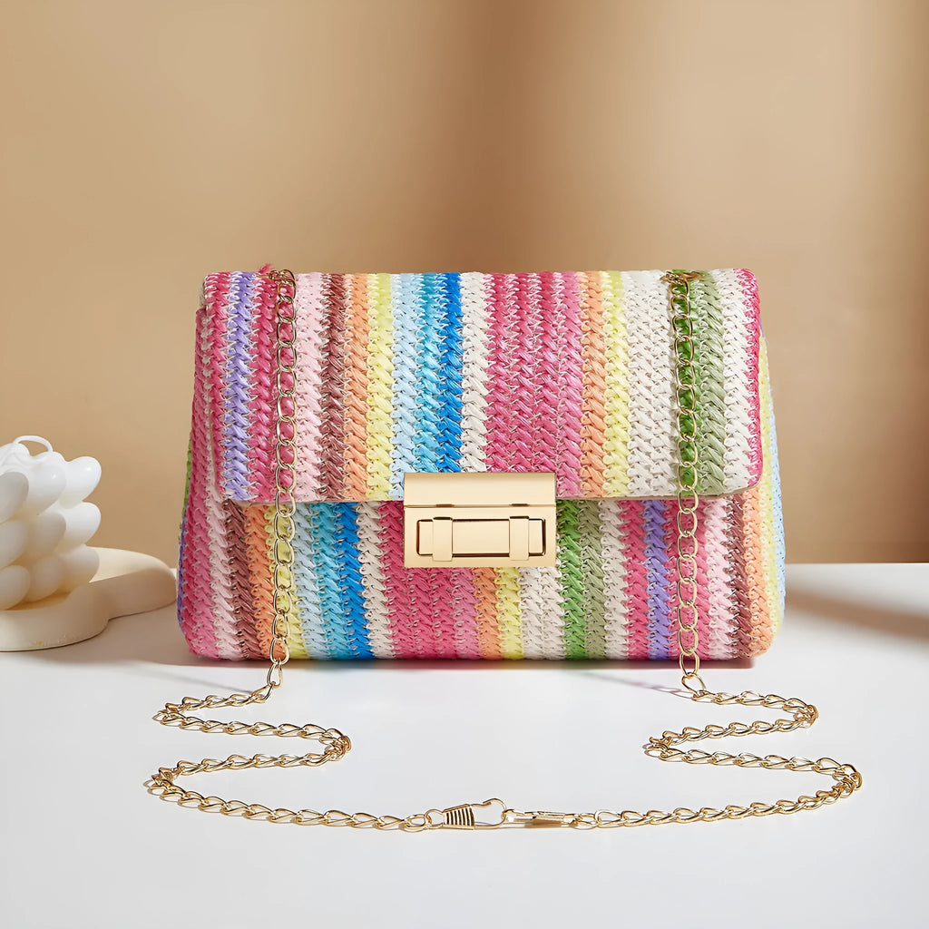 Women's soft straw cross-body bag in small horizontal square shape showing internal mobile phone compartment