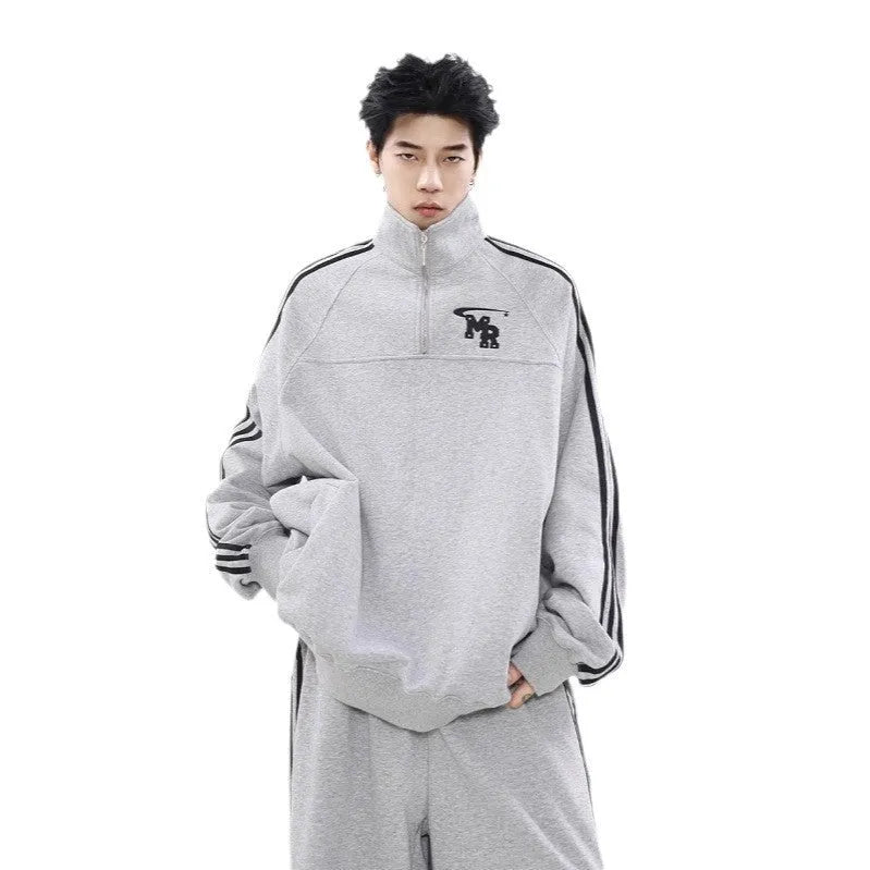 Black Hong Kong style retro hoodie with a stand collar on a hanger