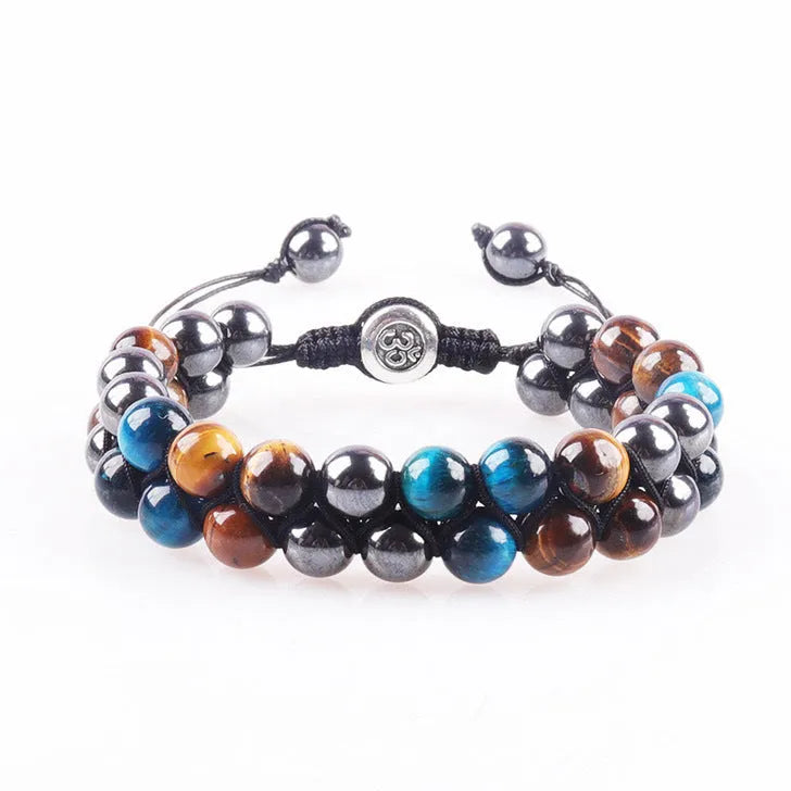 Men's black and gold tiger eye stone woven bracelet with magnetic clasp showing geometric pattern