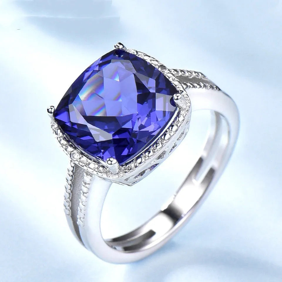 Women's sterling silver ring with a deep blue tanzanite gemstone.