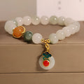 Women's ice jade crystal bracelet with a pearl and a detailed Xiangyun peace jade buckle.